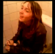 A French girl is having trouble taking a shit while sitting on a toilet as her friend films her difficulty. Low-quality video.
